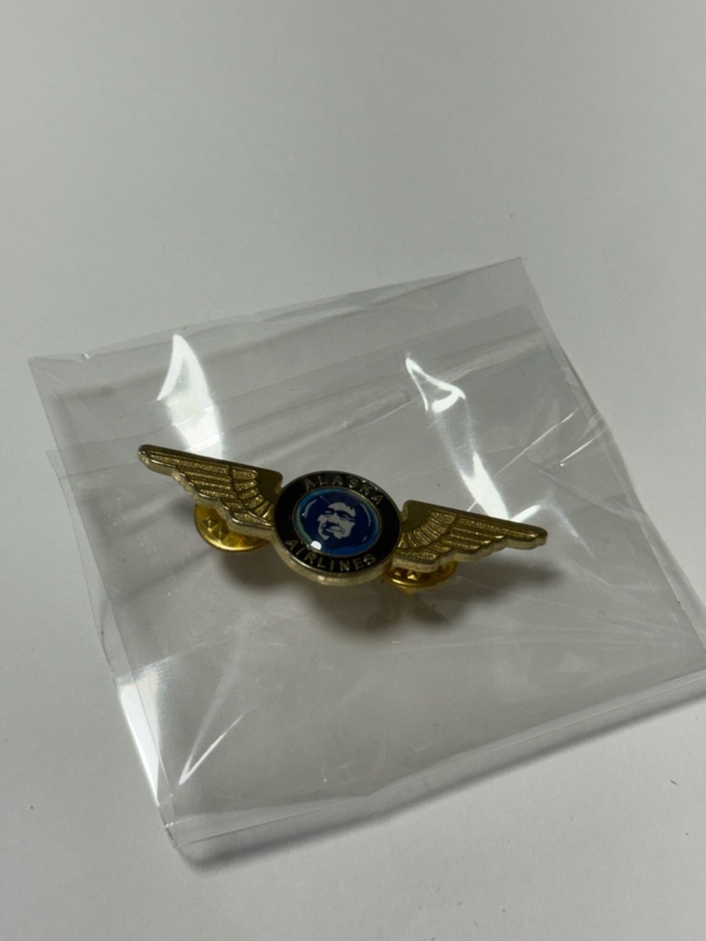 Gold-Tone Wing Brooch with Blue Emblem - Airline Style